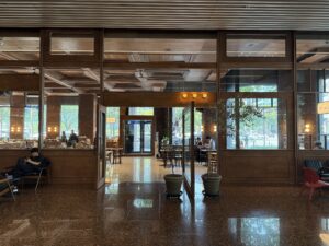 The grand wood-paneled façade, visible from the building lobby