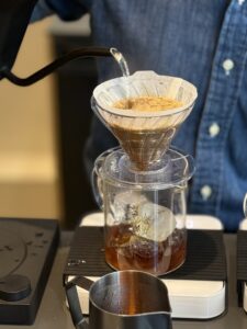 Barista making hand brew coffee at Alexander Coffee Studio